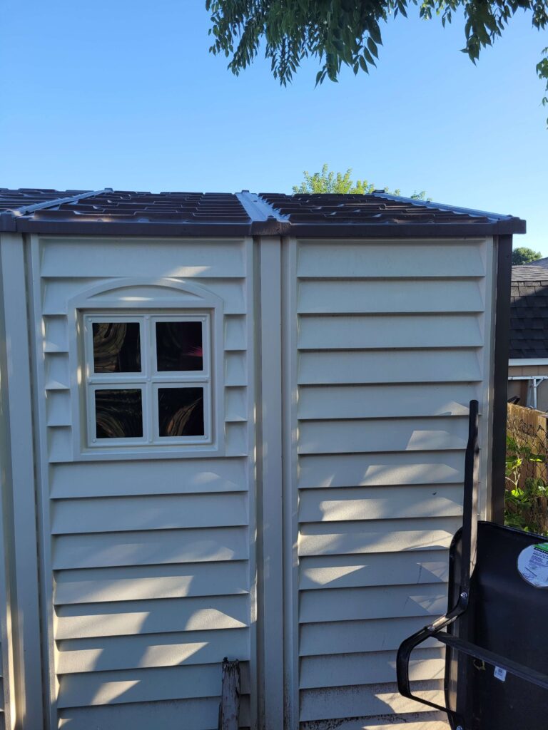 Vinyl Shed with Wheelbarrow