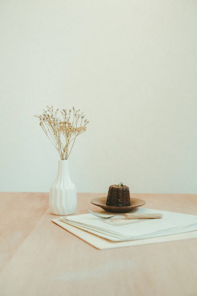 File Folder on desk fork and plate on top and small plant on side