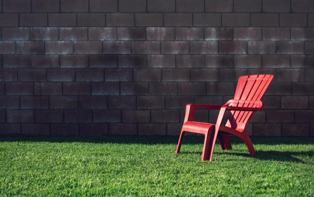 Quiet backyard setting red chair