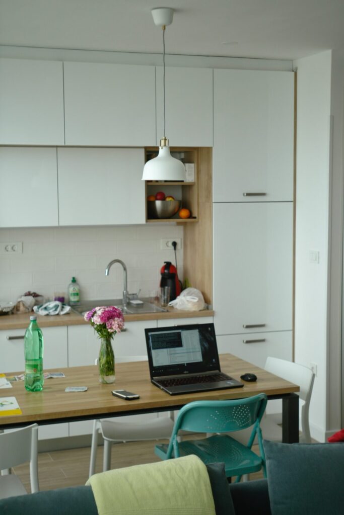 Laptop on table in the kitchen