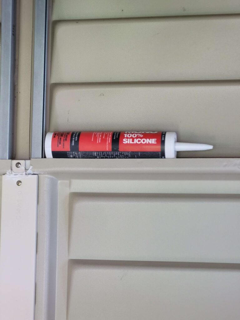 Silicone Sealant tube on shelf in a shed