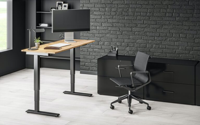 Standing desk with monitor in modern office with chair in the background