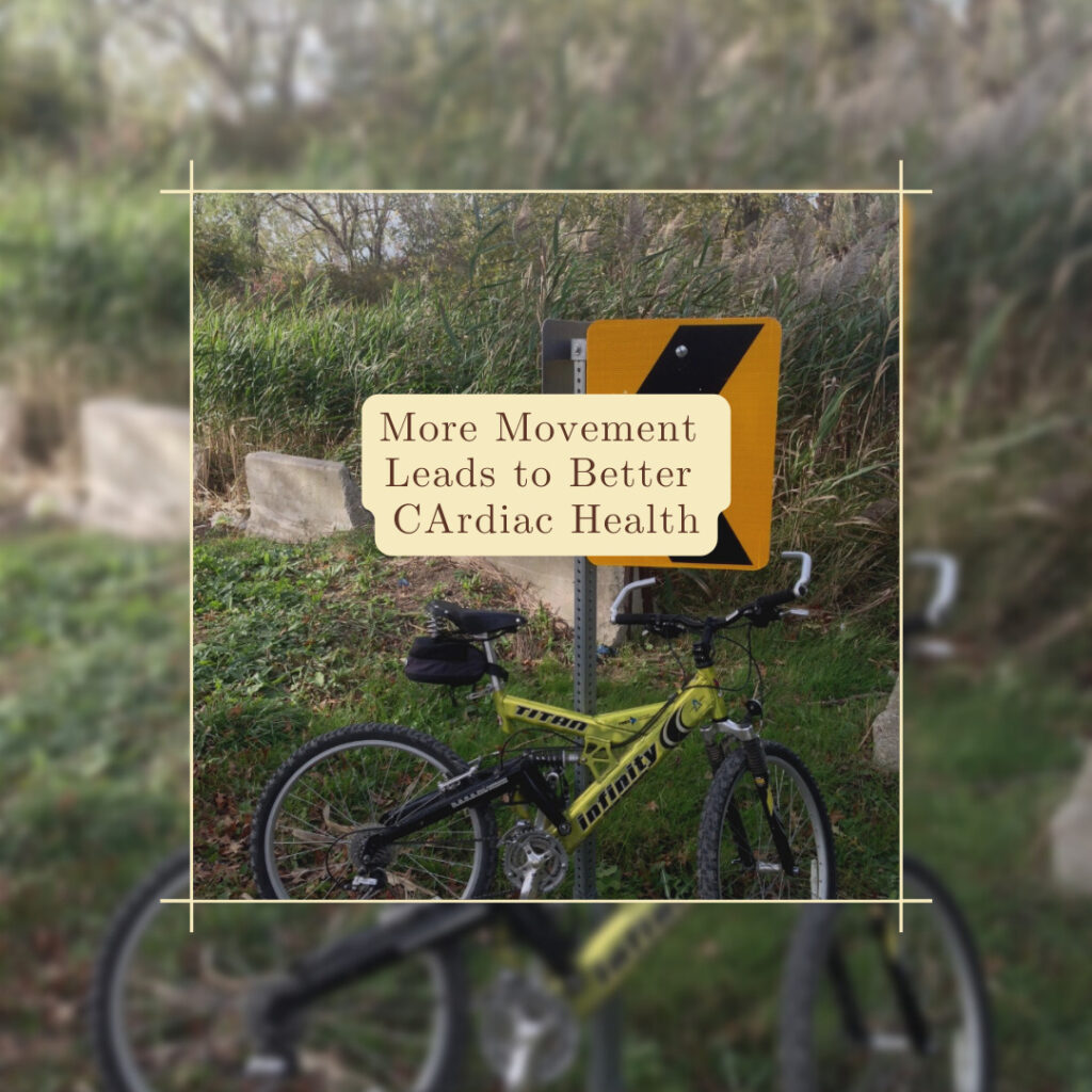 A bike leaning against a sign on grass and caption reading more movement leads to better cardiac health