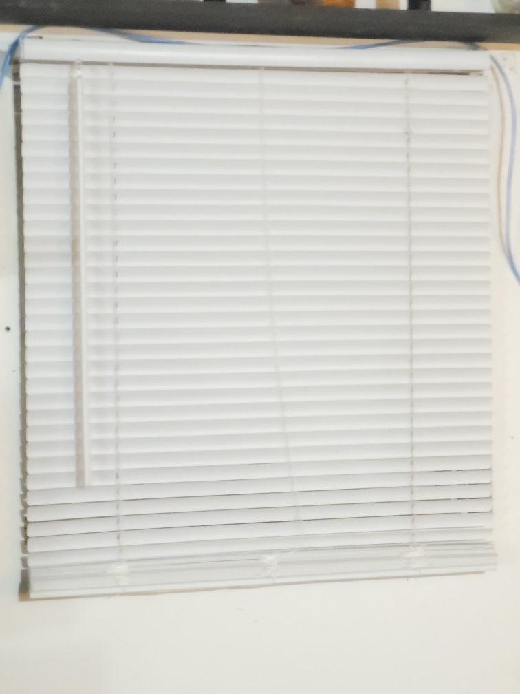 A simple white window blind