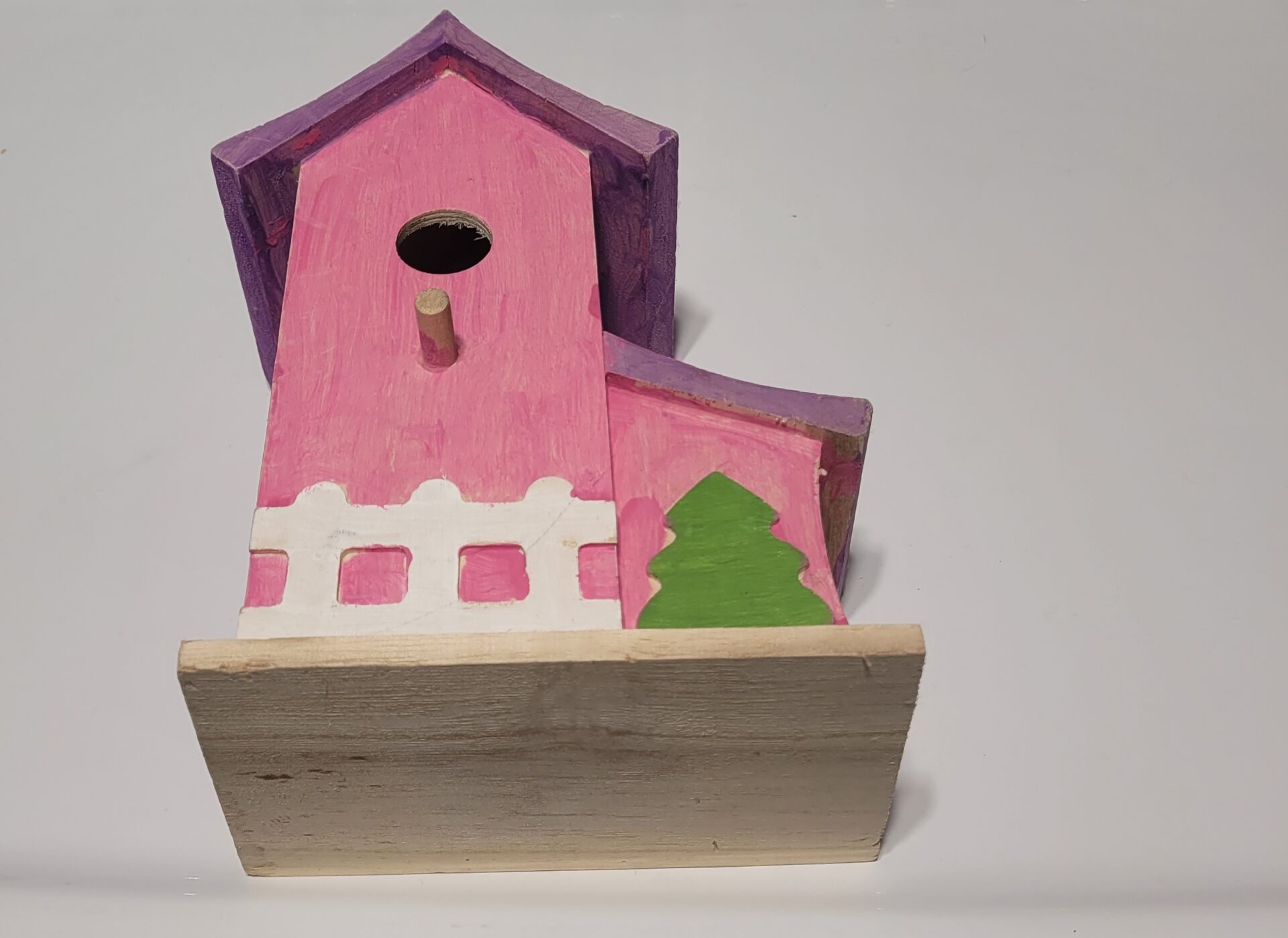 An image of a handmade wooden house as an example for toy maker number 97 on our list of backyard business ideas
