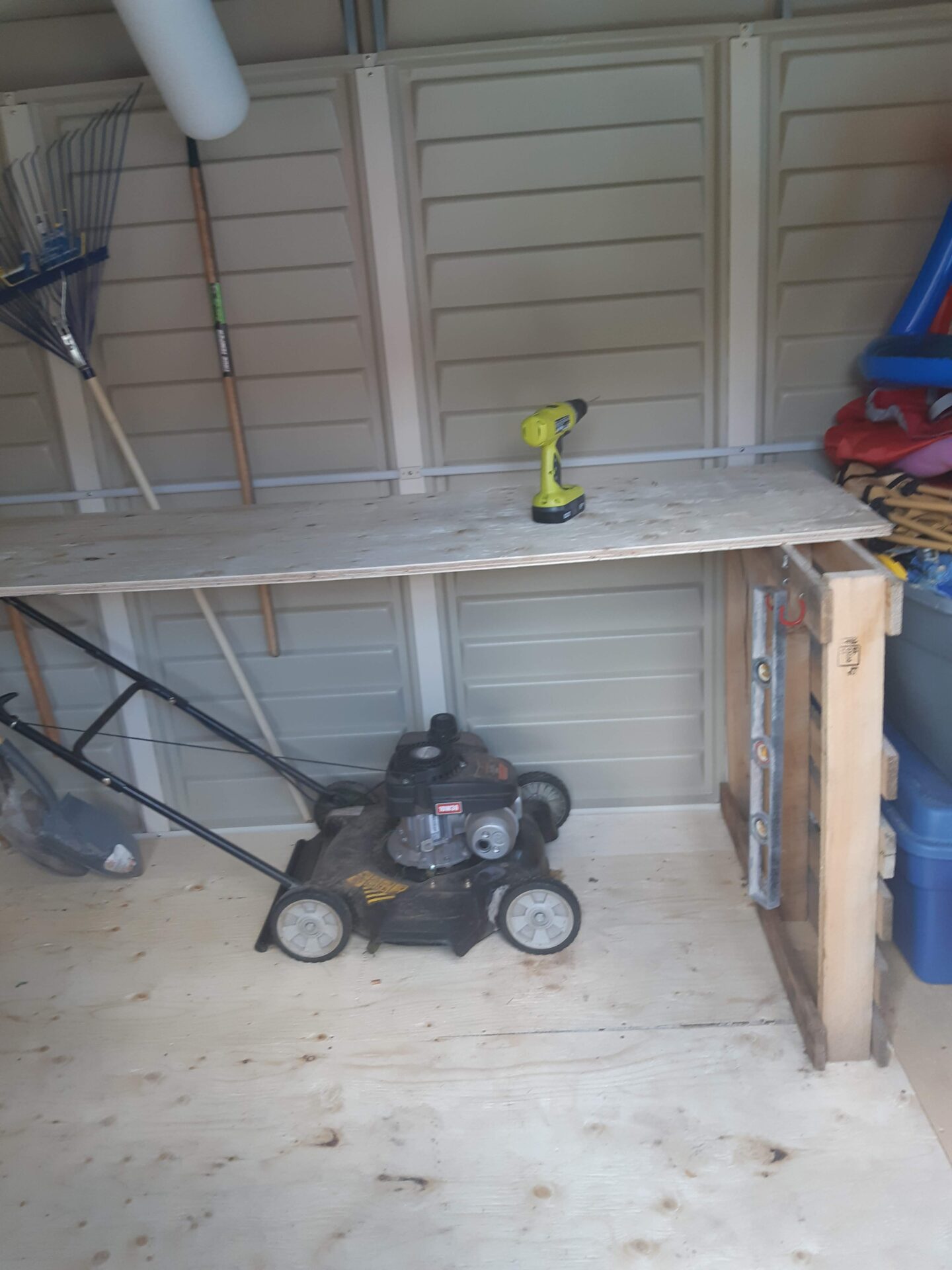 An image of a lawnmower in a shed as an example for a Lawnmower repair business number 75 on our list of backyard business ideas