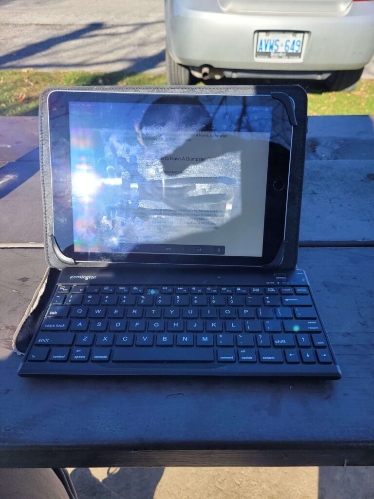 Ipad on a picnic table for producing TikTok videos to Make Money With Your Voice From Home